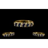 18ct Gold Nice Quality Sapphire and Diamond Dress Ring - the step cut sapphires with diamond