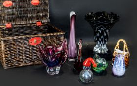 Basket of Coloured Glassware comprising: large vase in purple and pink; tall black and white glass