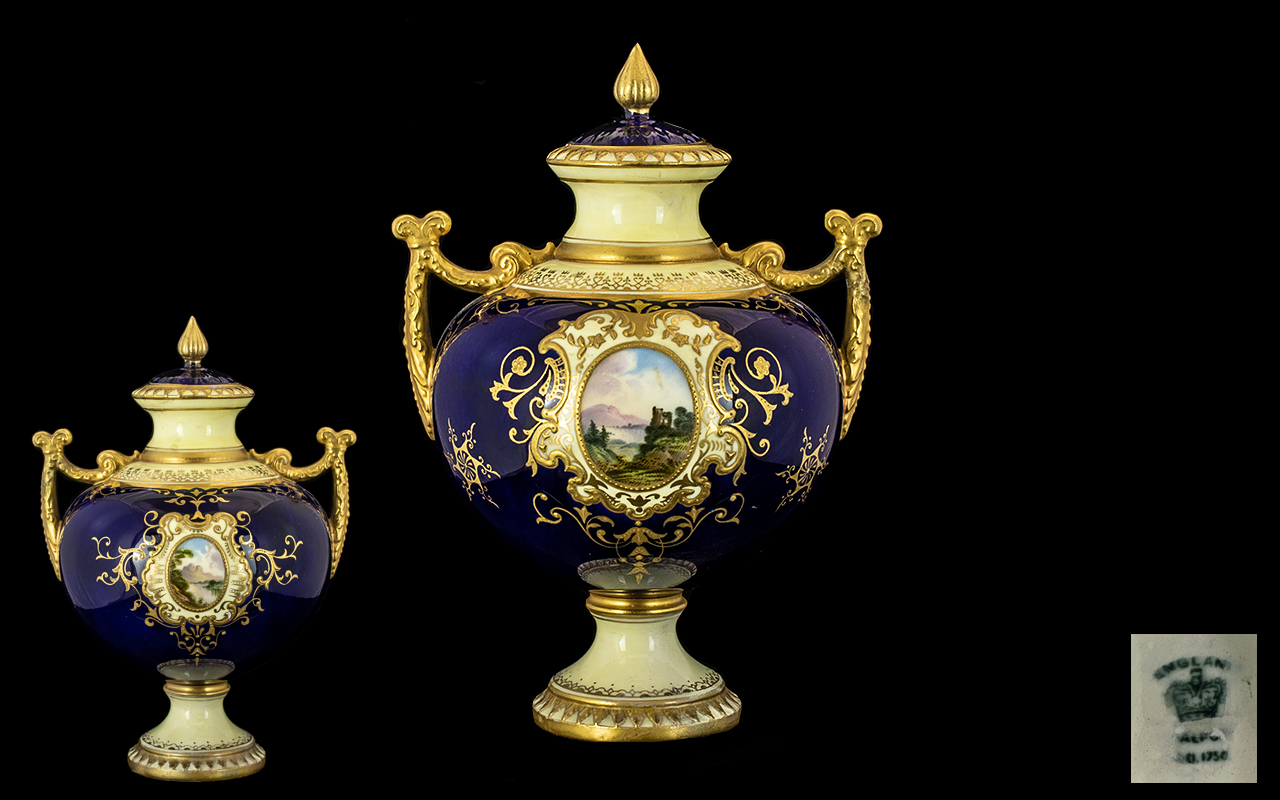 Coalport 19thC Hand Painted Twin Handle Lidded Globular Vase with painted scenic panels of lakes