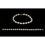 9ct Gold Pearl Set Bracelet with Gold Spacers - clasp marked 9.375. 7.5" inches - 18.