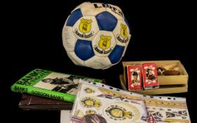 Box of Collectible Items to include a signed Everton football; a book of memoirs by Gordon Banks;