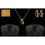 French 18ct Gold Diamond Pendant and Earring Set the pendant of scroll form in yellow and white