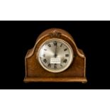 Oak Cased 1930s Shaped Top Mantle Clock with round steel face. Working condition.