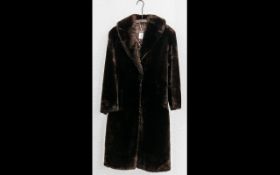 Ladies Full Length faux fur Dark Brown Coat. Shawl collar, two slit pockets, hook and eye fastening,