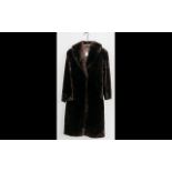 Ladies Full Length faux fur Dark Brown Coat. Shawl collar, two slit pockets, hook and eye fastening,