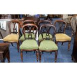 A Set of Six Rosewood Victorian Stand Chairs with shaped and carved backs.