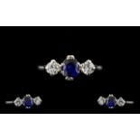 Platinum Set Nice Quality 3 Stone Diamond and Sapphire Ring of pleasing form, circa 1950's. The