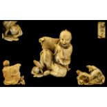 Japanese 19th Century Novelty Fine Quality Ivory Carving of a Seated Figure with his right foot on