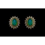 Pair of Opal Stud Earrings surrounded by CZ stones.