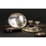 Collection of Plated Ware to include a silver plate round tray and a silver plate oval tray;