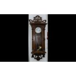 Austrian Oak Cased Double Brass Weighted Vienna Wall Clock. The case inspired by the art nouveau