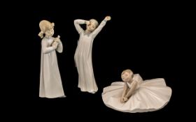 Lladro Figure of young girl playing an instrument, measures 8.5" tall.