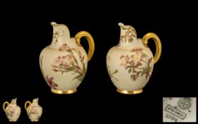 Royal Worcester Pair of Blush Ivory Helmet Shaped Jugs (2) each with handpainted floral decoration