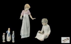 A Collection of Porcelain Figures 1. Nao girl in a nightdress carrying a candle stick 11 inches in