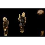 Japanese 19th Century Signed and Superb Quality Carved Stained Ivory Netsuke of a Japanese Male