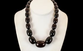 1920's Dark Cherry Amber Graduated Beaded Necklace. Weight 87.5 grams. 16 Inches - 40 cm In length.