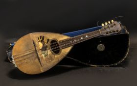 Vintage Mandolin in case, with some sheet music. In well used condition. Please see images.