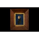 Early Victorian Miniature of a Gentleman Cut Out applied to a blue paper background in a period
