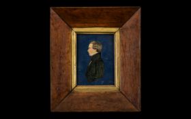 Early Victorian Miniature of a Gentleman Cut Out applied to a blue paper background in a period