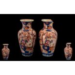 Pair of Imari Vases measuring 15" tall, one in as found condition, please confirm with photographs.
