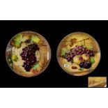 Pair of Victorian Art Pottery Decorated Chargers finely executed depicting grapes and fruits