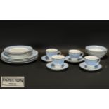 A Modern Four Setting Doulton Dinner Service. White and Pale blue border. Comprises dinner plates,