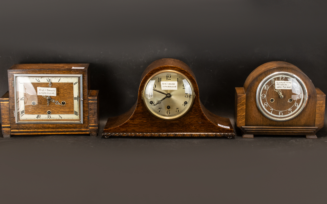 Three Oak Cased 1930s Mantle Clocks (2 Westminster Chimes) all working condition.