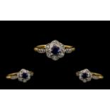 Attractive 18 ct Gold and Platinum Diamond and Sapphire Set Ring - Flowerhead design. Marked 18 ct