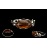 Baltic Amber Antique Art Nouveau Silver Bracelet with sinuous entwining leaves, surmounted with a