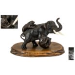 Japanese Bronze Figure Group Depicting Two Tigers Attacking An Elephant, Signed To Base, Raised On A
