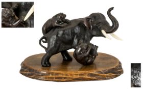 Japanese Bronze Figure Group Depicting Two Tigers Attacking An Elephant, Signed To Base, Raised On A