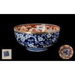 Japanese Imari Bowl of Typical Palette the outside body decorated in underglazed blue.