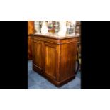 A Victorian Mahogany Two Door Library Cupboard with arched topped doors with rounded corners below