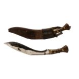 20thC Gurkha Kukri Complete With Brown Leather Scabbard. Wood And Brass Handle.
