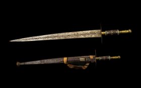 Unusual Engraved Blade North African Sword, in a tooled leather scabbard,
