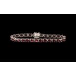 Garnet Tennis Bracelet, 23.5cts of the deep red garnet with generous flashes of dark pink, rhodolite