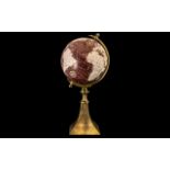 Decorative Globe on a brass stand. Measures 18" tall. Please see photograph.
