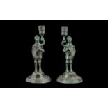 Pair of Brass Lacquered Candlesticks in the form of Medieval Knights. 8" tall, signs of wear.