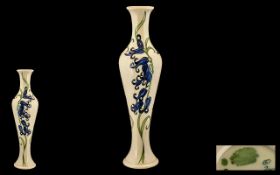 Moorcroft Modern - Tall Tube lined Vase of Slim Form ' Blue bells ' Design on Cream Ground.