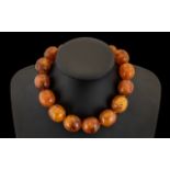 1930s Amber Bakelite Bead Necklace of large size. 93 grams. See accompanying images.