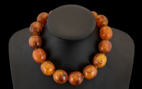 1930s Amber Bakelite Bead Necklace of large size. 93 grams. See accompanying images.