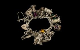 Silver Charm Bracelet - Heavy hallmarked Silver charm bracelet, loaded with charms,