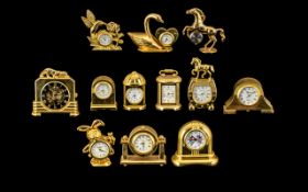 A Collection of Good Quality Gold Gilt & Brass Miniature Clocks. Twelve in total, all of solid