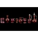 Collection of Ruby Glass Ware comprising two lidded decanters