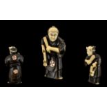 Japanese 19th Century Superb Quality Carved Stained Ivory Netsuke depicting a Japanese male figure