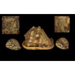 Three Antique Carved Cameo Shells Probably Italian comprising of a Pair of Cowrei Shells carved