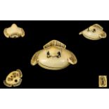 Japanese Ivory Netsuke Modelled In The Form Of A Stylized Fukura Suzume (Tongue-Cut Sparrow)