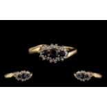 Ladies 9ct Gold Attractive Diamond & Sapphire Set Dress Ring. The three central sapphires surrounded