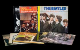 Collection Of Records. To include Beatles, dire straits, Stevie Wonder, Louis Armstrong, Don Mclean,