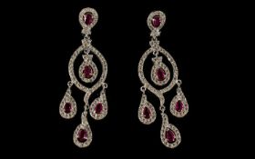 Faux Ruby and Diamond Chandelier Earrings, the pear cut faux rubies being the feature stones on a